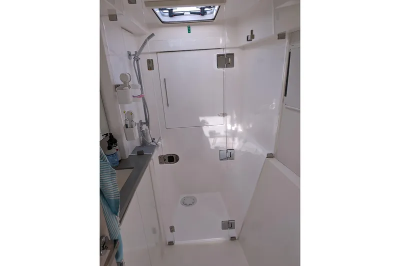 Changing Keys Yacht Photos Pics Modern bathroom interior of 2020 Leopard 40 yacht, featuring sleek shower and fixtures.