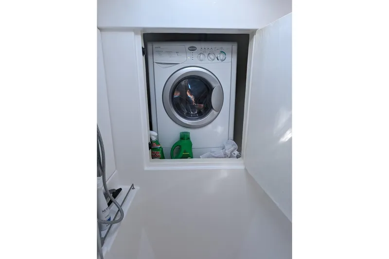 Changing Keys Yacht Photos Pics Washing machine in Leopard 40 yacht, 2020 model, with detergent bottles nearby.