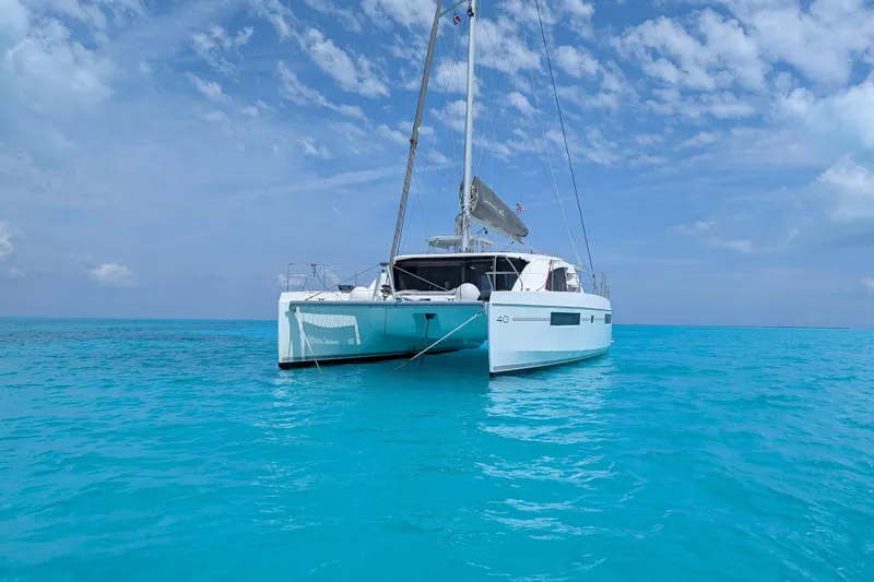 Changing Keys Yacht Photos Pics 2020 Leopard 40 catamaran sailing on clear turquoise waters under a blue sky.
