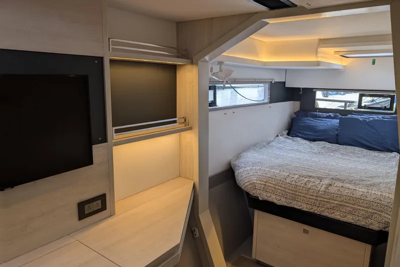 Changing Keys Yacht Photos Pics Modern interior of 2020 Leopard 40 yacht with cozy bed and TV.