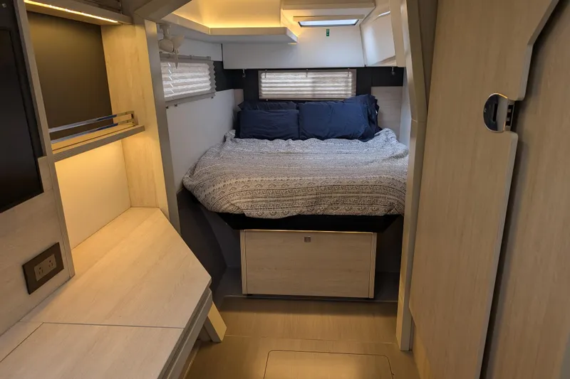 Changing Keys Yacht Photos Pics Cozy bedroom interior of 2020 Leopard 40 catamaran with modern design and soft lighting.