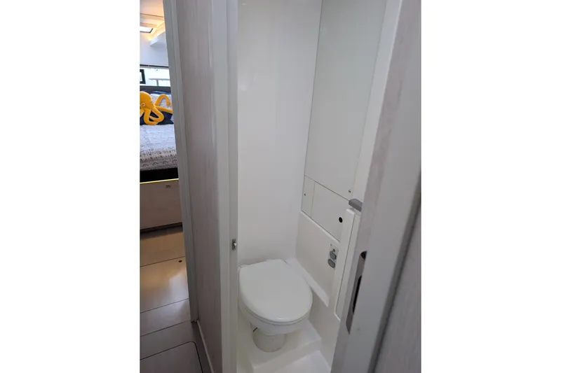 Changing Keys Yacht Photos Pics Compact bathroom in a 2020 Leopard 40 yacht, featuring a modern toilet design.
