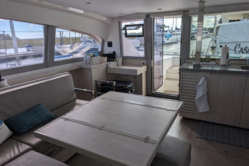 Changing Keys Yacht Photos Pics Interior of a 2020 Leopard 40 catamaran with modern seating and dockside view.