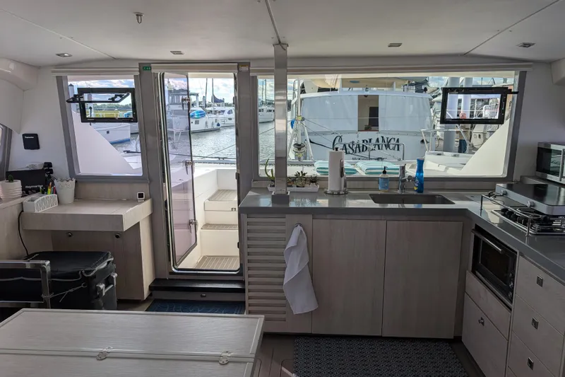 Changing Keys Yacht Photos Pics Modern kitchen interior of 2020 Leopard 40 catamaran with marina view.