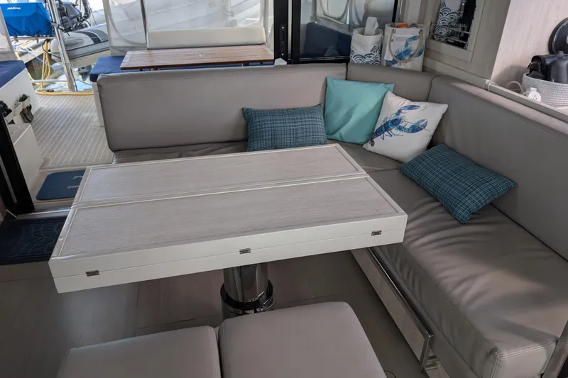 Changing Keys Yacht Photos Pics Modern Leopard 40 yacht interior with cushioned seating and decorative pillows, 2020 model.