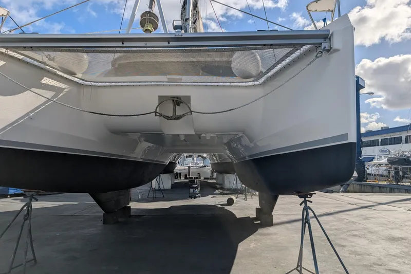 Changing Keys Yacht Photos Pics 2020 Leopard 40 catamaran on dry dock, showcasing hull and underbody structure.