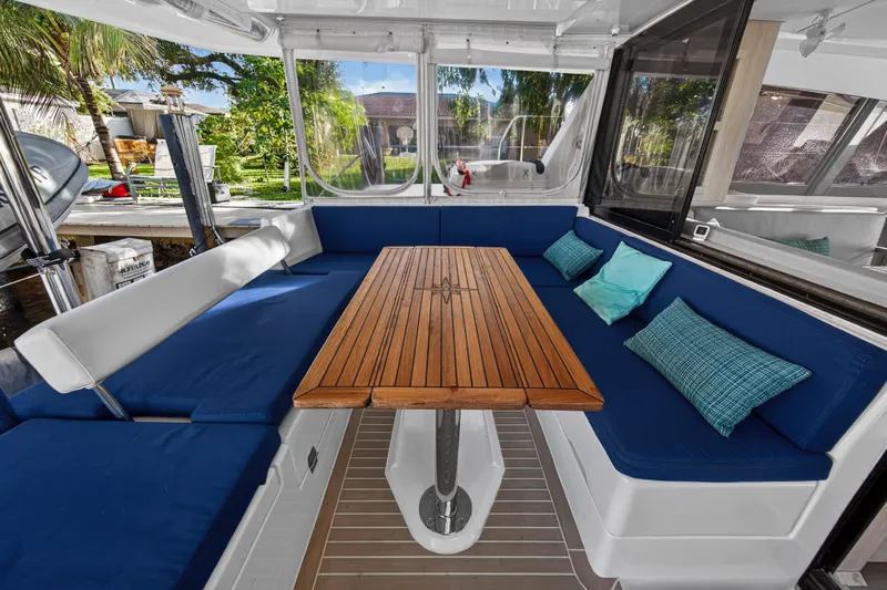 Changing Keys Yacht Photos Pics Leopard 40 catamaran interior with blue seating and wooden table, 2020 model.