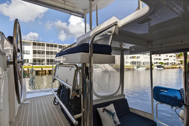 Changing Keys Yacht Photos Pics Modern Leopard 40 catamaran interior with steering wheel, seating, and marina view.