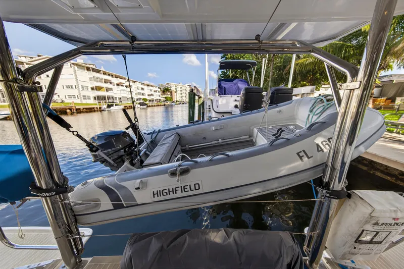 Changing Keys Yacht Photos Pics Leopard 40 catamaran with Highfield dinghy, docked in a scenic waterfront location, 2020 model.