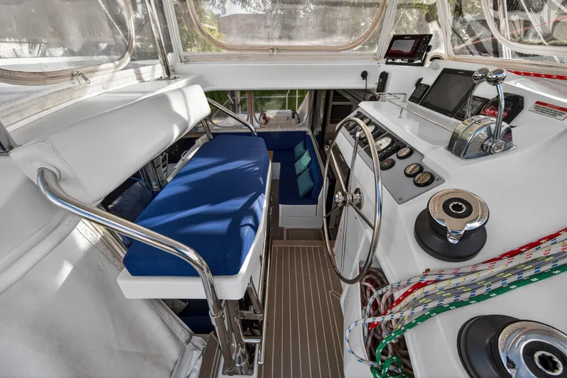 Changing Keys Yacht Photos Pics Helm station of 2020 Leopard 40 catamaran with blue seating and navigation controls.