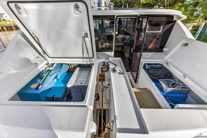 Changing Keys Yacht Photos Pics 2020 Leopard 40 catamaran deck with open storage compartments and interior view.