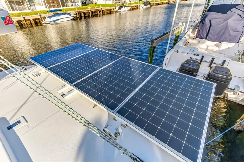 Changing Keys Yacht Photos Pics Solar panels on a 2020 Leopard 40 catamaran docked by a waterfront.