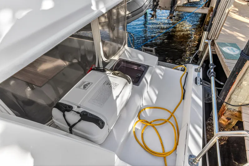 Changing Keys Yacht Photos Pics Leopard 40 catamaran deck with safety equipment and yellow rope, docked by water.