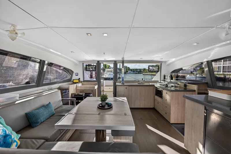 Changing Keys Yacht Photos Pics Modern interior of a 2020 Leopard 40 catamaran with spacious seating and kitchen area.