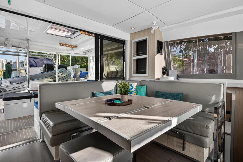 Changing Keys Yacht Photos Pics Leopard 40 catamaran interior with modern dining area, featuring sleek design and comfortable seating.