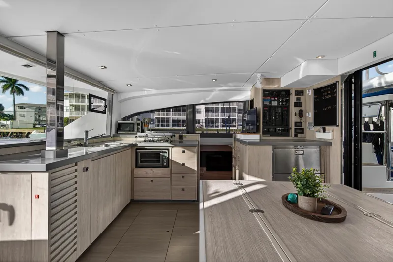 Changing Keys Yacht Photos Pics Modern interior of 2020 Leopard 40 catamaran with sleek kitchen and dining area.