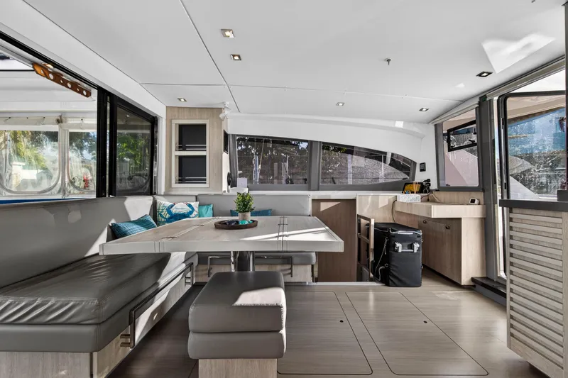 Changing Keys Yacht Photos Pics Modern interior of 2020 Leopard 40 catamaran with sleek dining area and panoramic windows.
