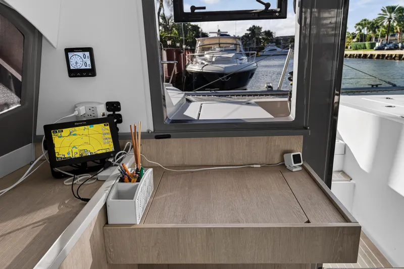 Changing Keys Yacht Photos Pics Interior of 2020 Leopard 40 yacht with navigation equipment and marina view.