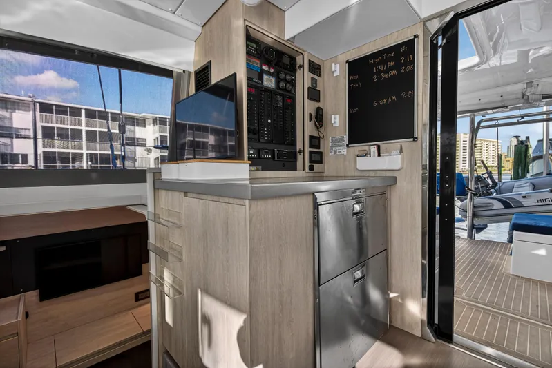 Changing Keys Yacht Photos Pics Interior of 2020 Leopard 40 yacht with control panel and outdoor view.