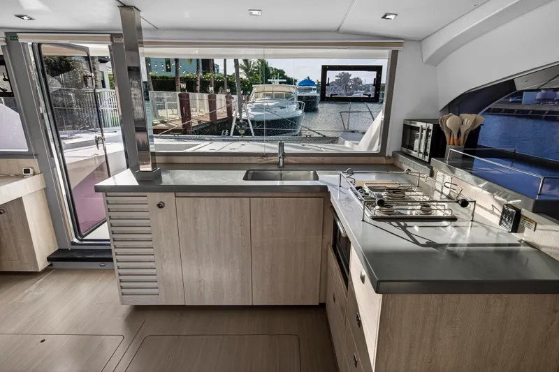 Changing Keys Yacht Photos Pics Modern kitchen interior on a 2020 Leopard 40 yacht, featuring sleek countertops and appliances.