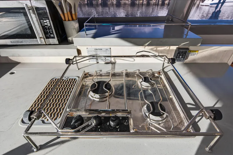 Changing Keys Yacht Photos Pics Modern kitchen stove on 2020 Leopard 40 yacht with stainless steel finish.