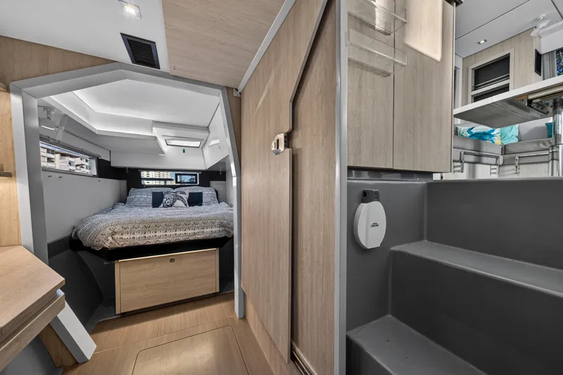 Changing Keys Yacht Photos Pics Luxurious interior of 2020 Leopard 40 catamaran featuring a cozy bedroom and modern design.