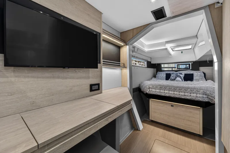 Changing Keys Yacht Photos Pics Luxurious interior of 2020 Leopard 40 yacht with modern bedroom and TV.