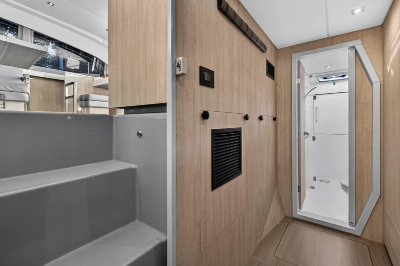 Changing Keys Yacht Photos Pics Interior of 2020 Leopard 40 yacht featuring modern bathroom and wooden paneling.