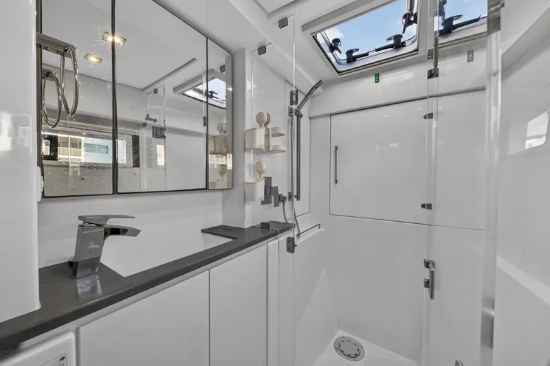 Changing Keys Yacht Photos Pics Modern bathroom interior on 2020 Leopard 40 yacht, featuring sleek fixtures and ample lighting.