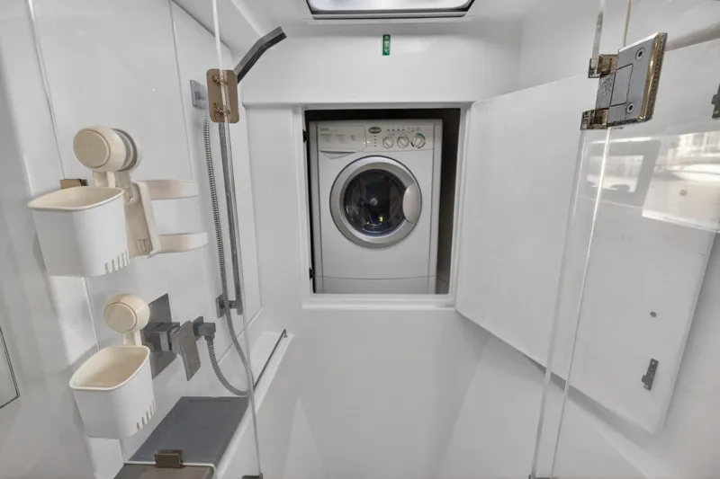 Changing Keys Yacht Photos Pics Laundry area in 2020 Leopard 40 yacht with washing machine and storage.