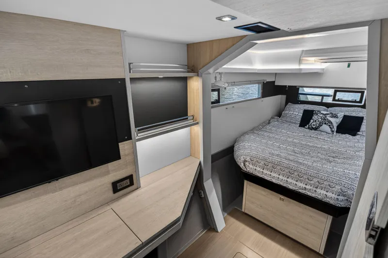 Changing Keys Yacht Photos Pics Modern interior of 2020 Leopard 40 yacht with cozy bedroom and TV area.