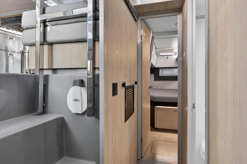 Changing Keys Yacht Photos Pics Modern interior of 2020 Leopard 40 yacht, featuring sleek wood finishes and compact design.