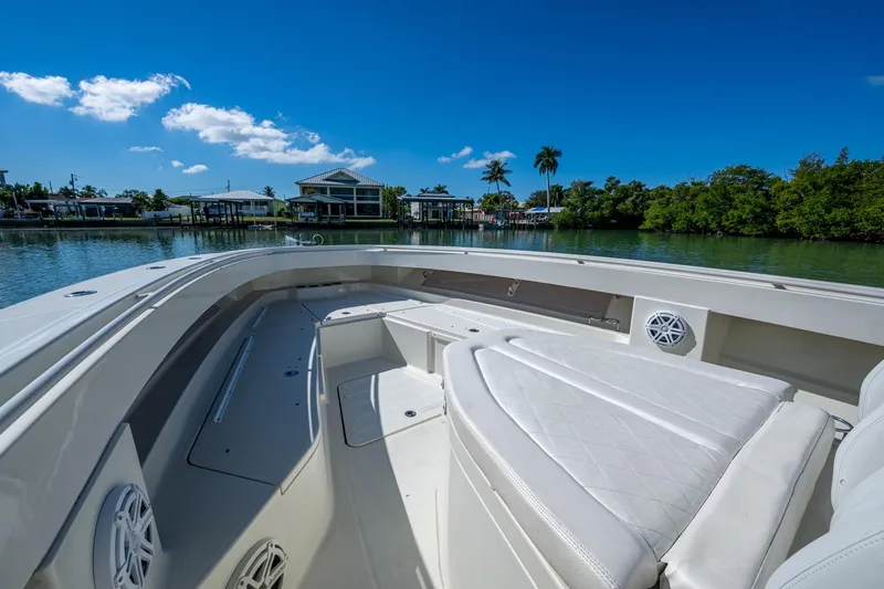  Yacht Photos Pics 2018 HCB 42 Siesta boat interior with luxurious seating, set against a serene waterfront backdrop.