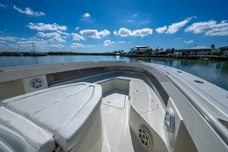  Yacht Photos Pics 2018 HCB 42 Siesta boat interior with seating, on a sunny day by the water.