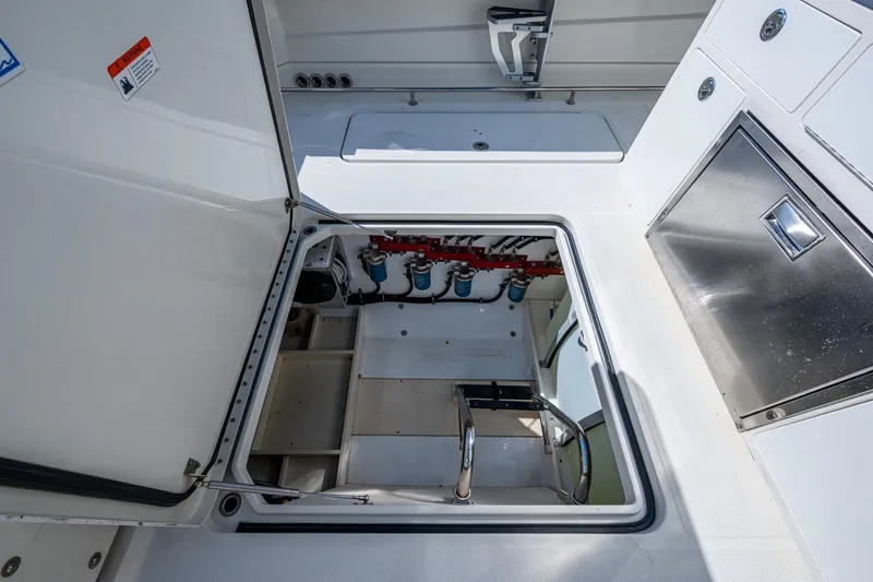  Yacht Photos Pics 2018 HCB 42 Siesta boat hatch open, revealing interior storage and equipment.