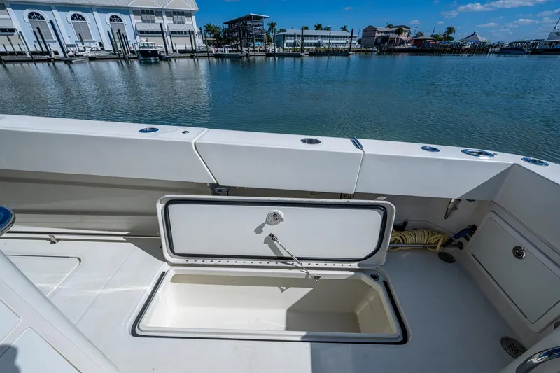  Yacht Photos Pics 2018 HCB 42 Siesta boat with open storage compartment, dockside view.