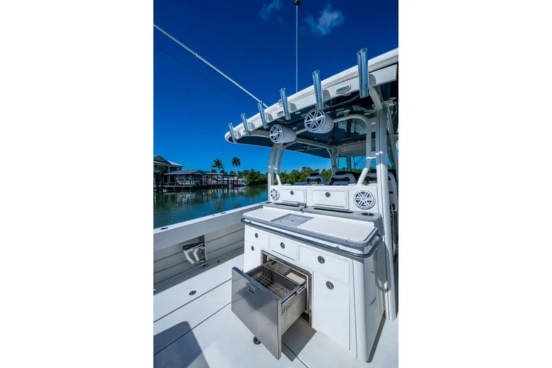  Yacht Photos Pics 2018 HCB 42 Siesta boat with open storage, sleek design, and scenic waterfront view.