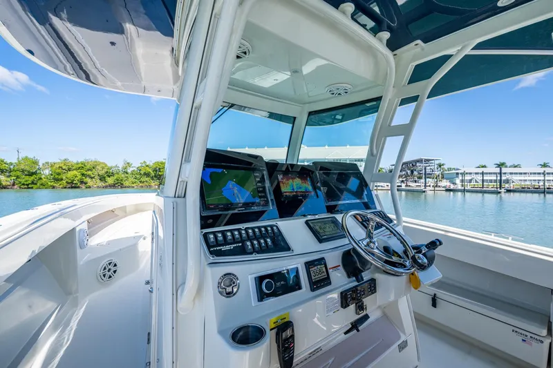  Yacht Photos Pics 2018 HCB 42 Siesta boat helm with advanced navigation systems and waterfront view.