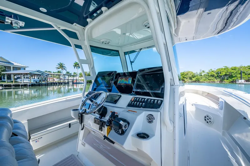  Yacht Photos Pics 2018 HCB 42 Siesta boat helm with advanced navigation system and waterfront view.