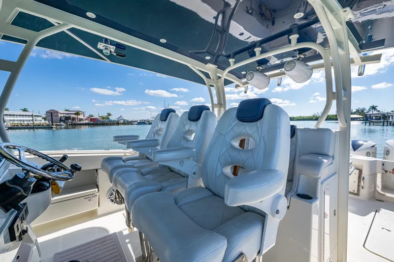  Yacht Photos Pics 2018 HCB 42 Siesta boat interior with luxurious seating and scenic waterfront view.