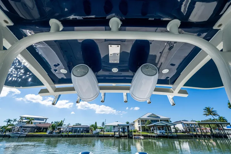  Yacht Photos Pics 2018 HCB 42 Siesta boat canopy with speakers, overlooking waterfront homes.