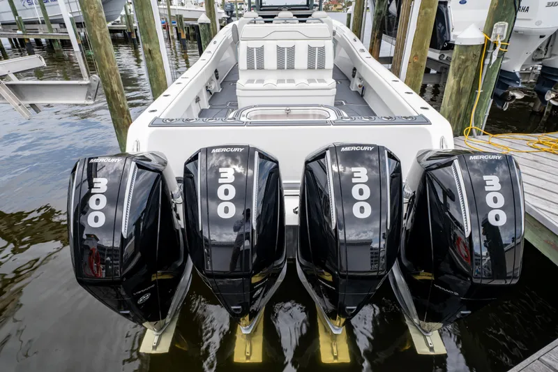  Yacht Photos Pics 2022 Invincible 39 Open Fisherman with four Mercury 300 engines docked at marina.