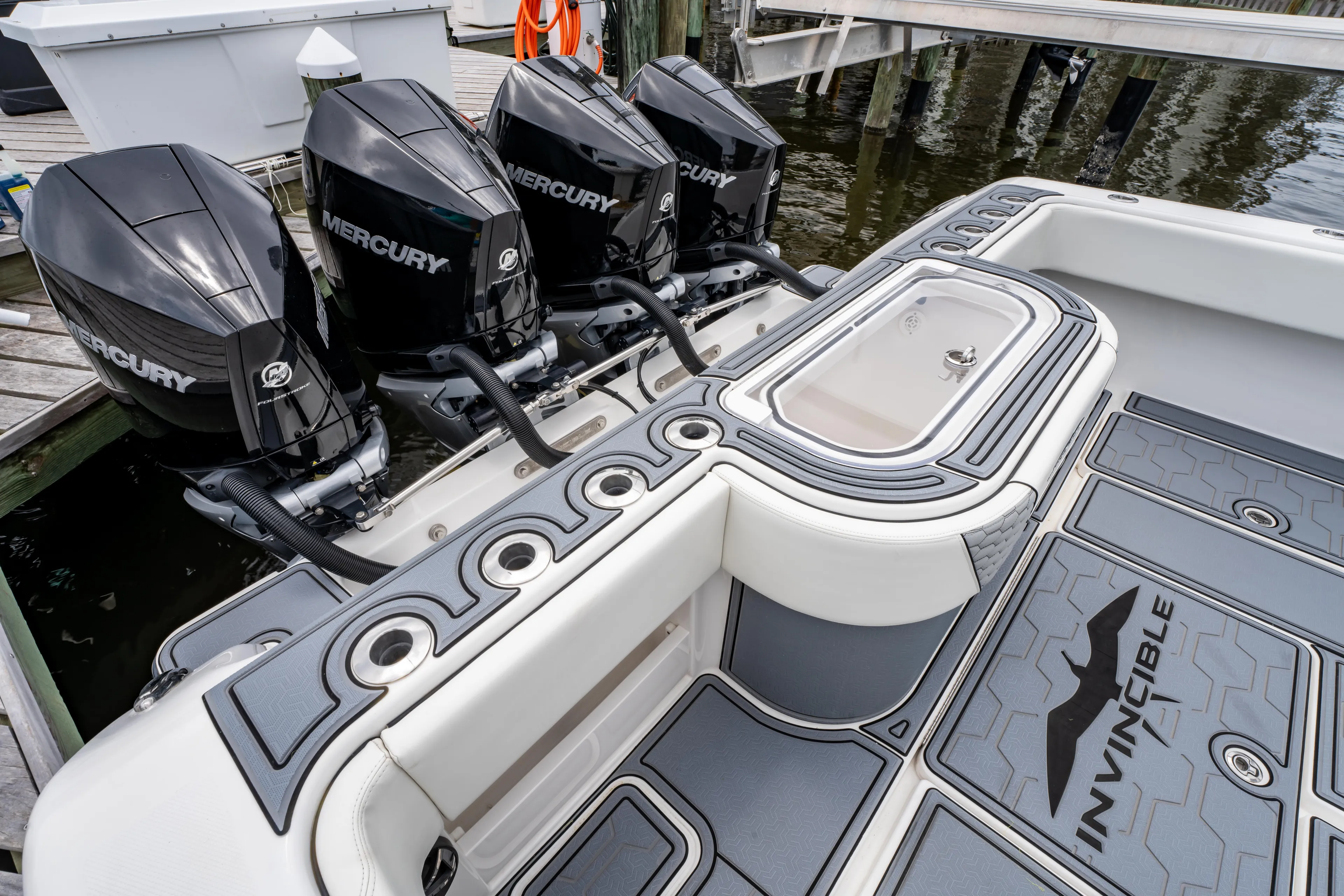  Yacht Photos Pics 2022 Invincible 39 Open Fisherman with four Mercury engines at a dock.