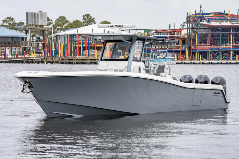  Yacht Photos Pics 2022 Invincible 39 Open Fisherman boat on water, featuring sleek design and multiple engines.