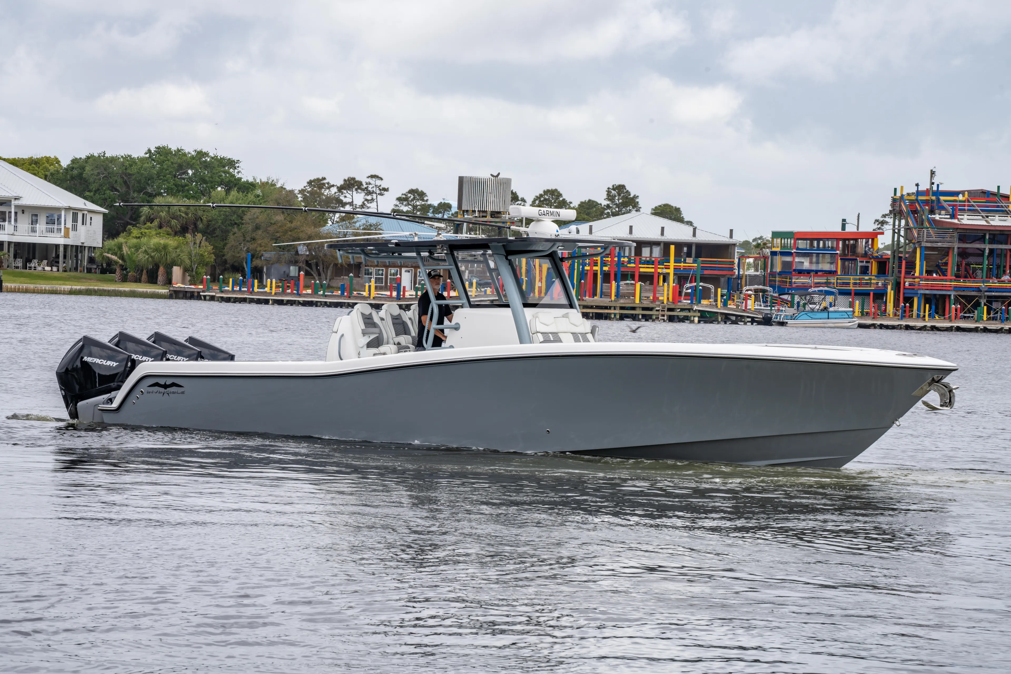  Yacht Photos Pics 2022 Invincible 39 Open Fisherman boat on water, featuring sleek design and powerful engines.