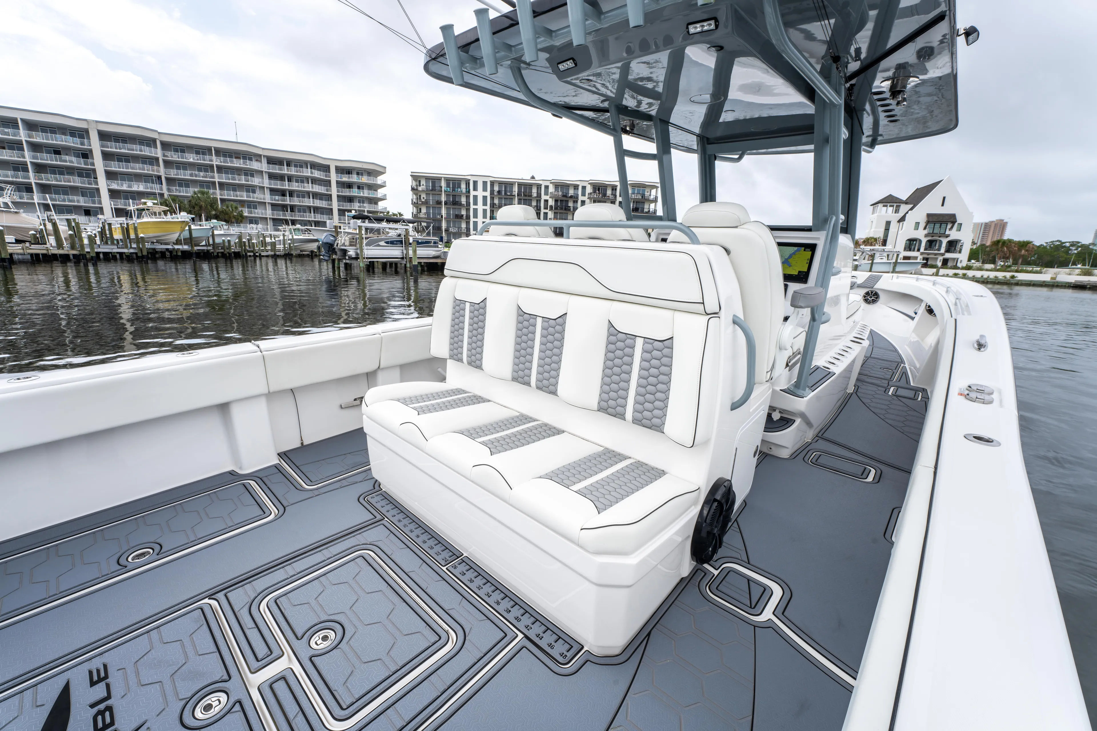  Yacht Photos Pics 2022 Invincible 39 Open Fisherman boat with sleek seating and modern design at a marina.