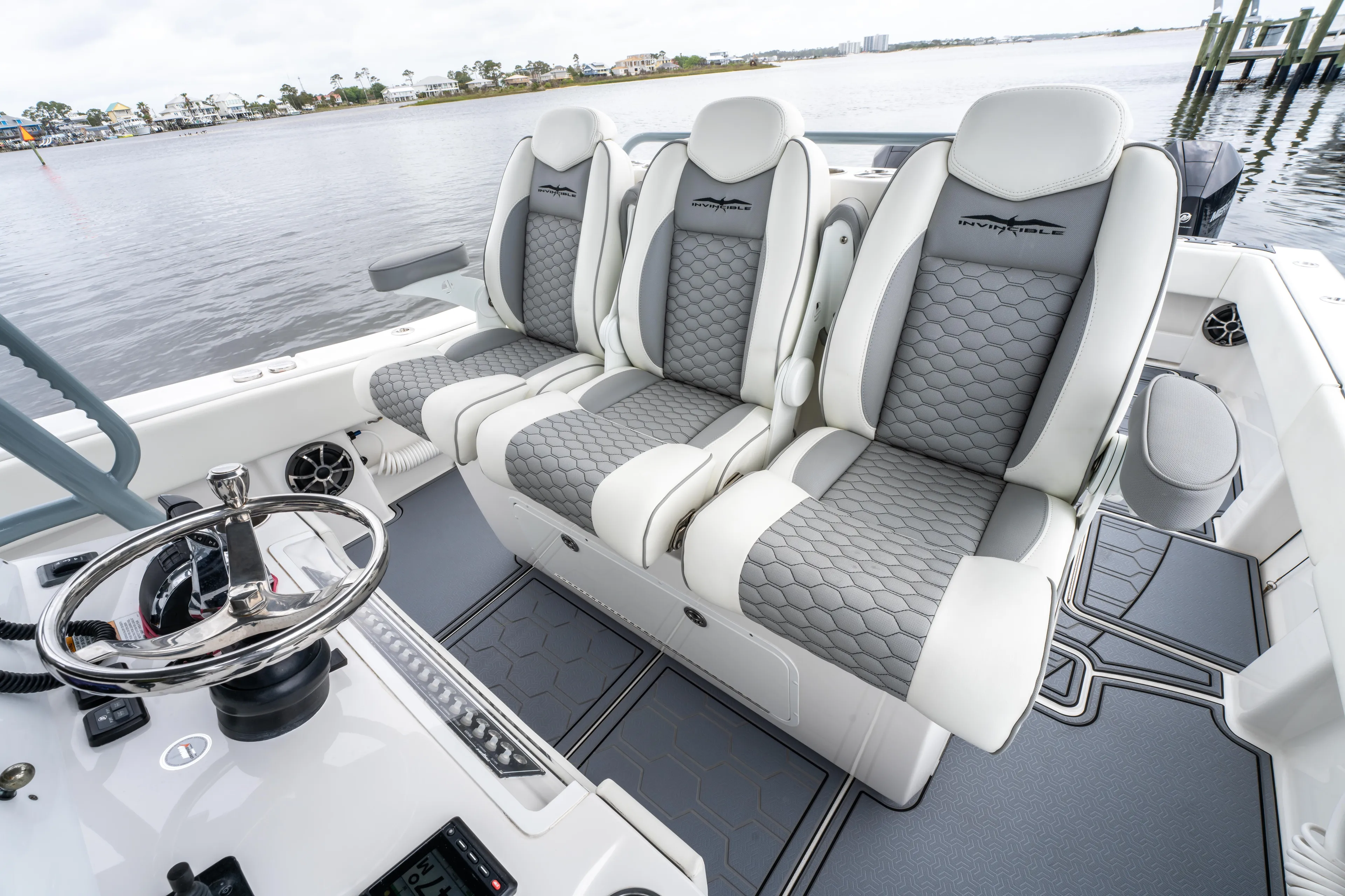  Yacht Photos Pics 2022 Invincible 39 Open Fisherman boat interior with luxurious seating and steering wheel.