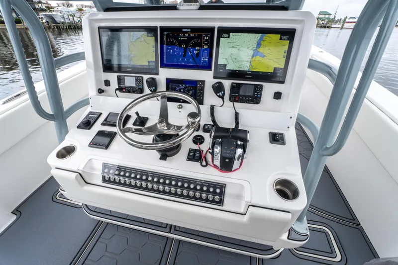  Yacht Photos Pics 2022 Invincible 39 Open Fisherman boat console with advanced navigation and control systems.