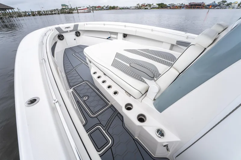  Yacht Photos Pics 2022 Invincible 39 Open Fisherman boat interior with cushioned seating and sleek design.
