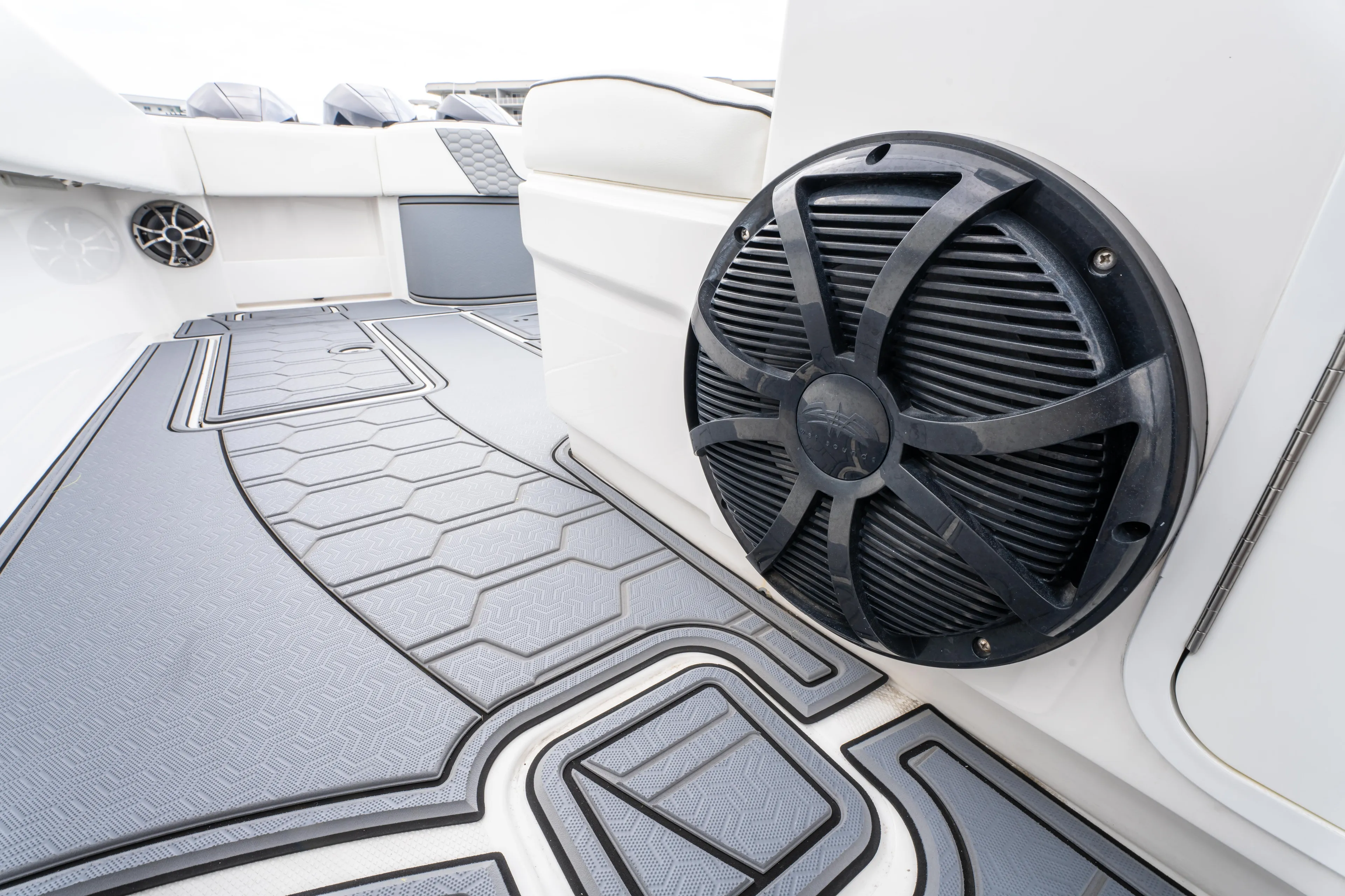  Yacht Photos Pics 2022 Invincible 39 Open Fisherman boat interior with speaker and hexagonal-patterned flooring.